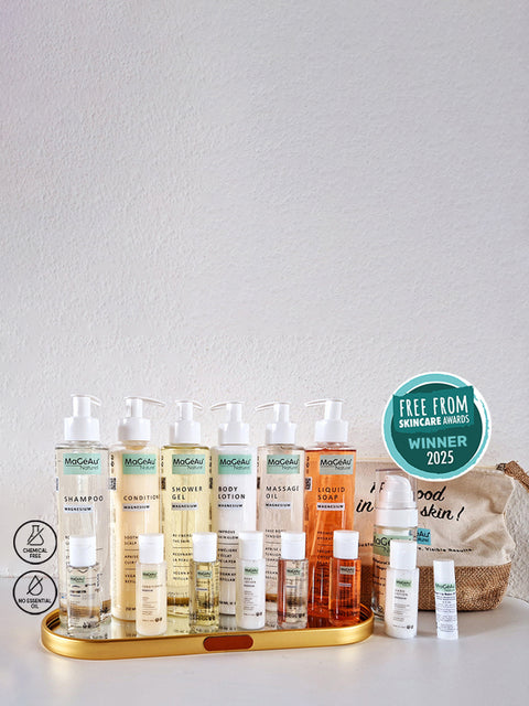 Set of skincare and hair care products on a white surface with a neutral background