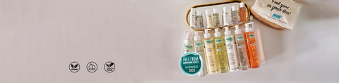 Set of skincare products with a small bag on a light gray background