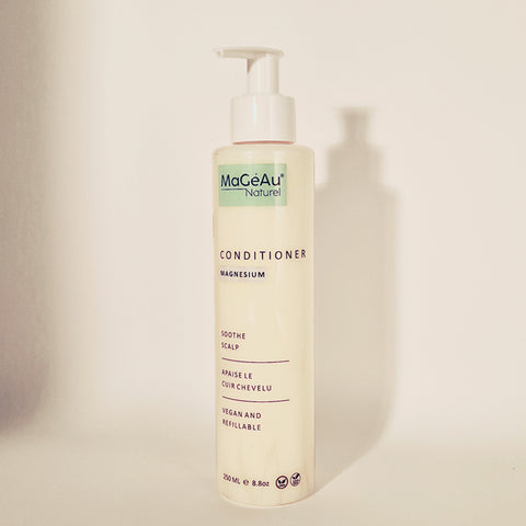 MaGeAu Naturel conditioner bottle on a beige background