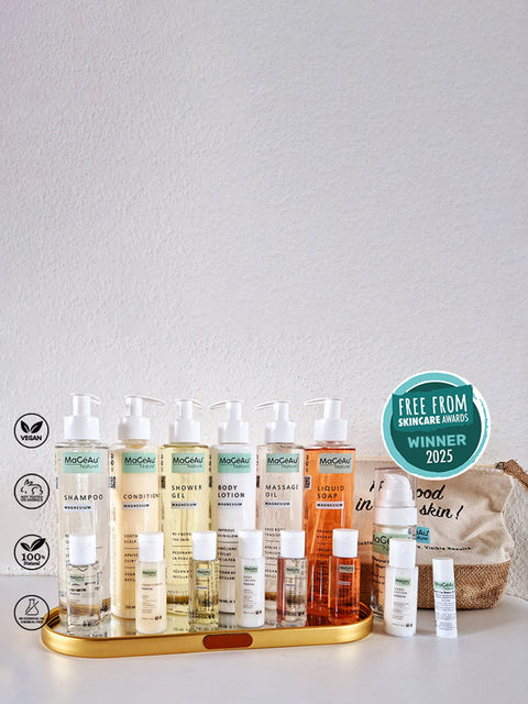 Set of skincare and hair care products on a white surface with a neutral background