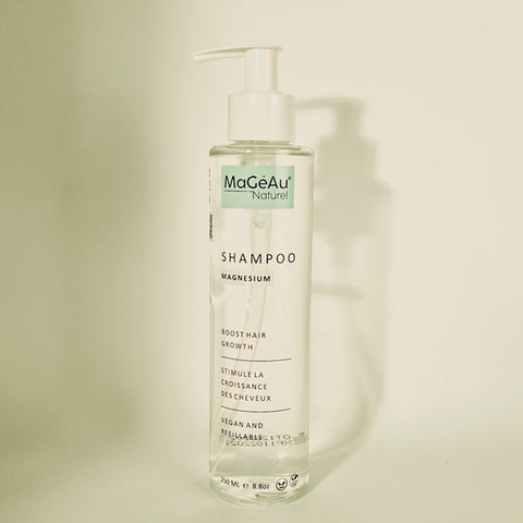 Shampoo bottle with 'MaGeAu Naturel' label on a beige background